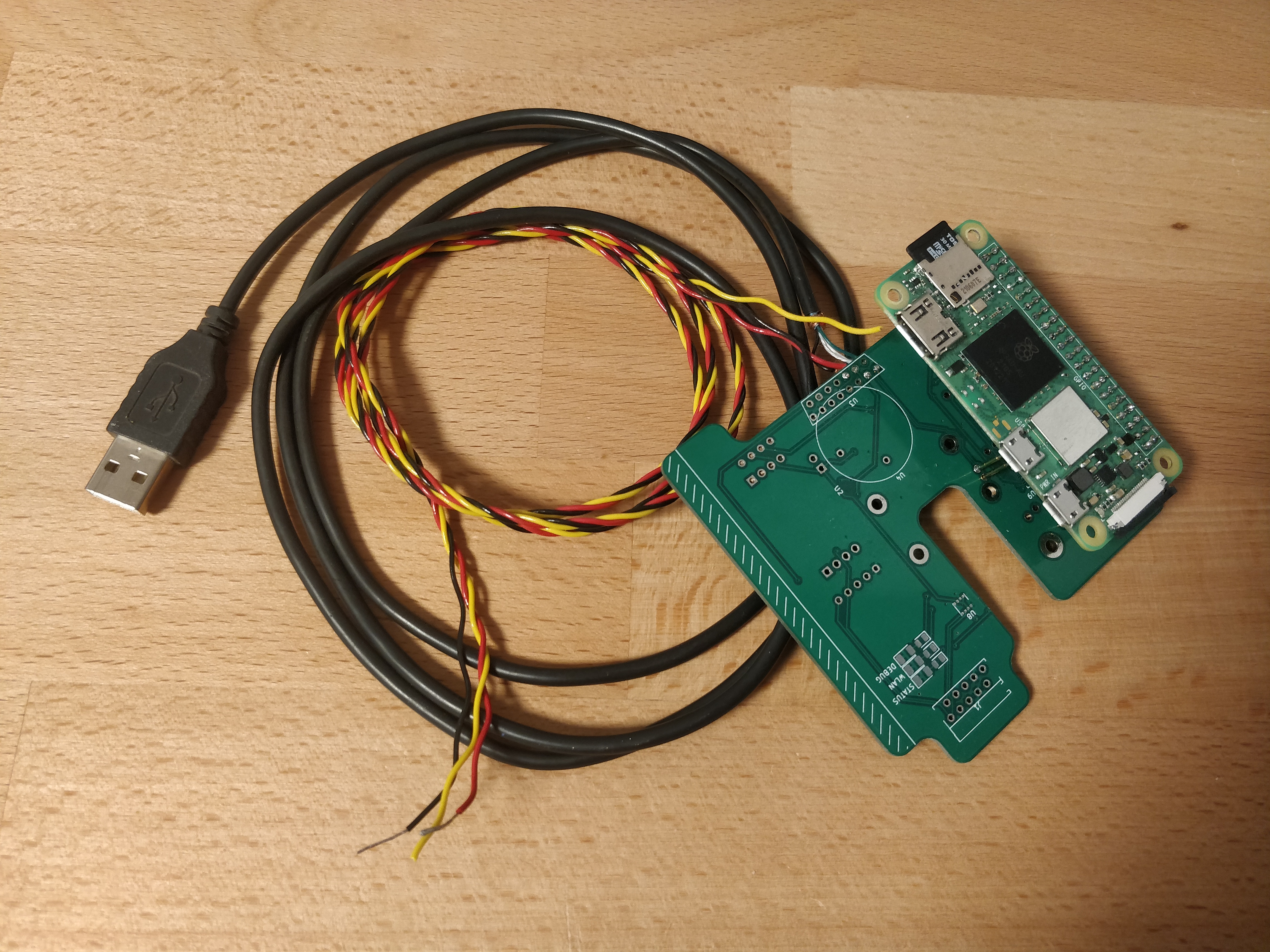 Mainboard Prototype with Raspberry Pi Zero 2W, power, and USB cable